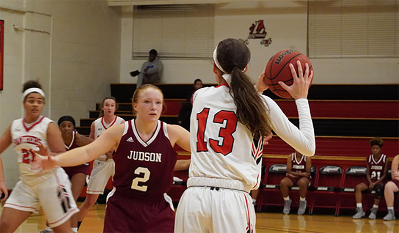 women's basketball team on court