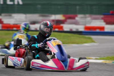 Football player karting on course