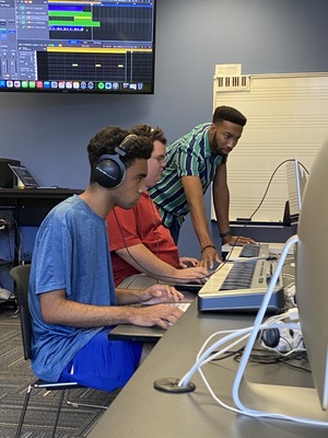 Students learn music production at West Side