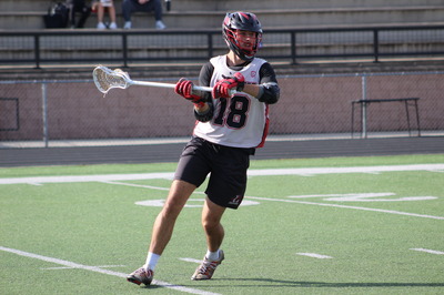 Senior competes in lacrosse game