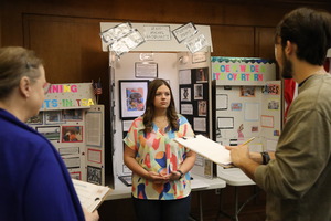 Student presents research in 2024