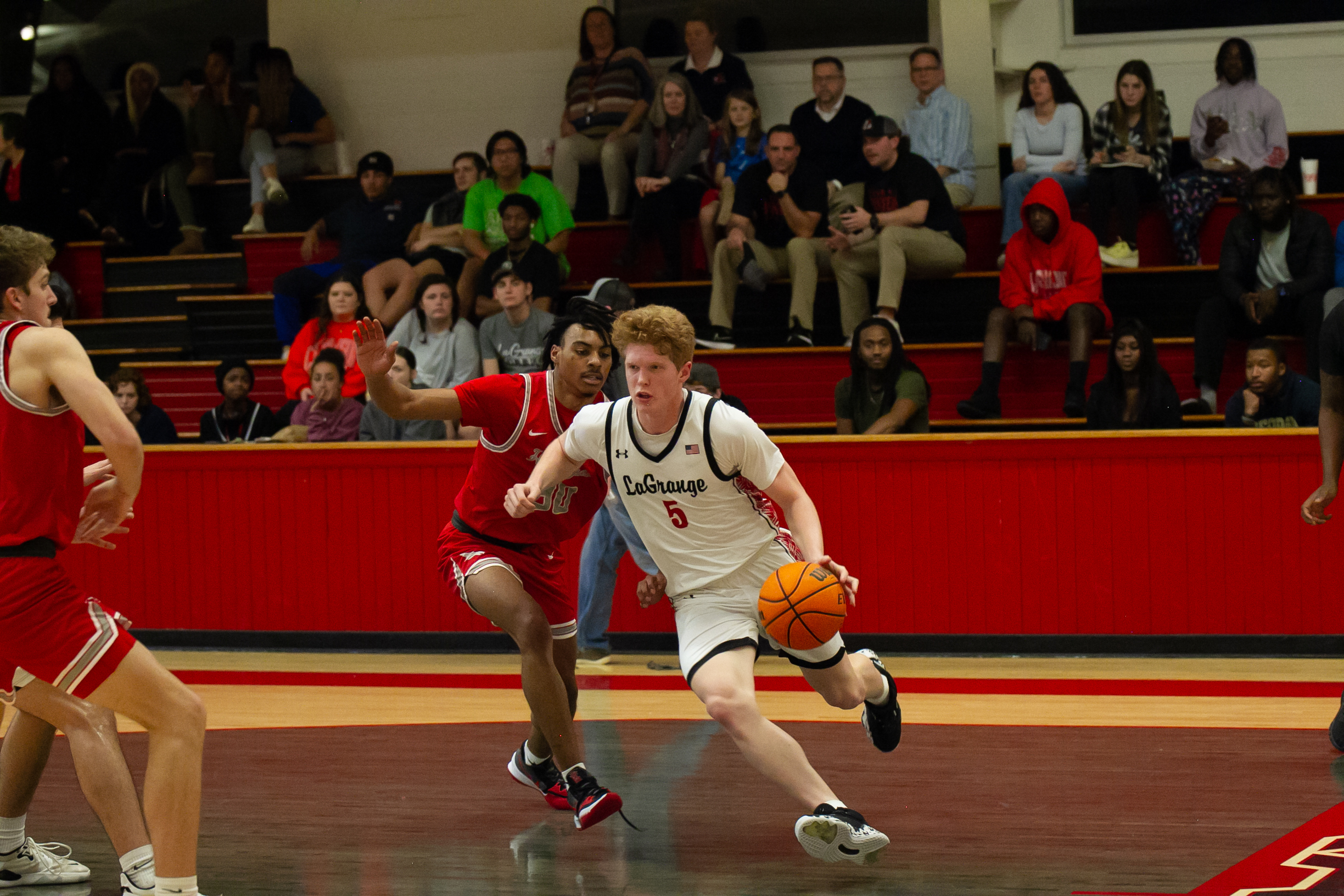 Student running across court