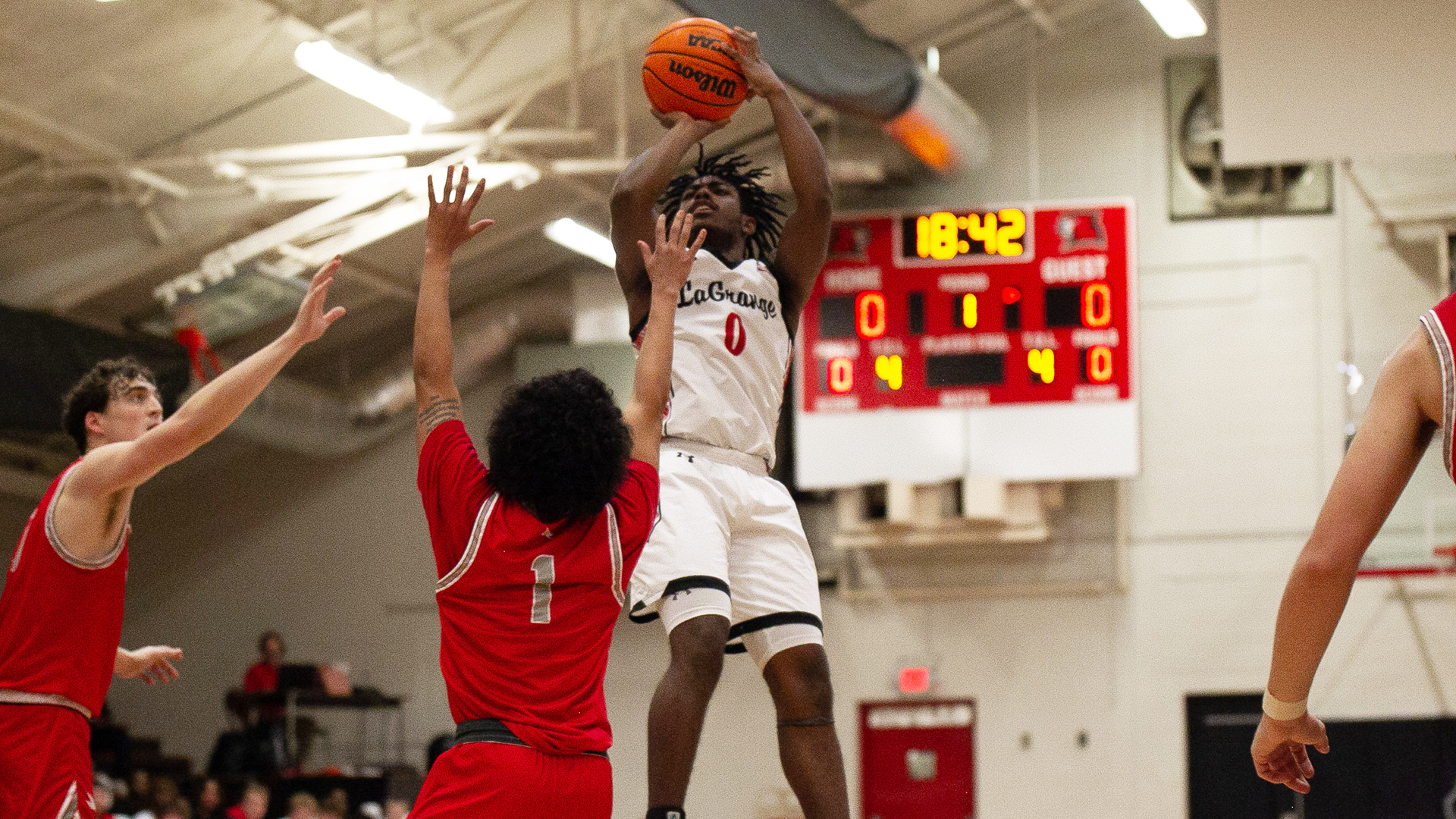 Student basketball player taking a shot