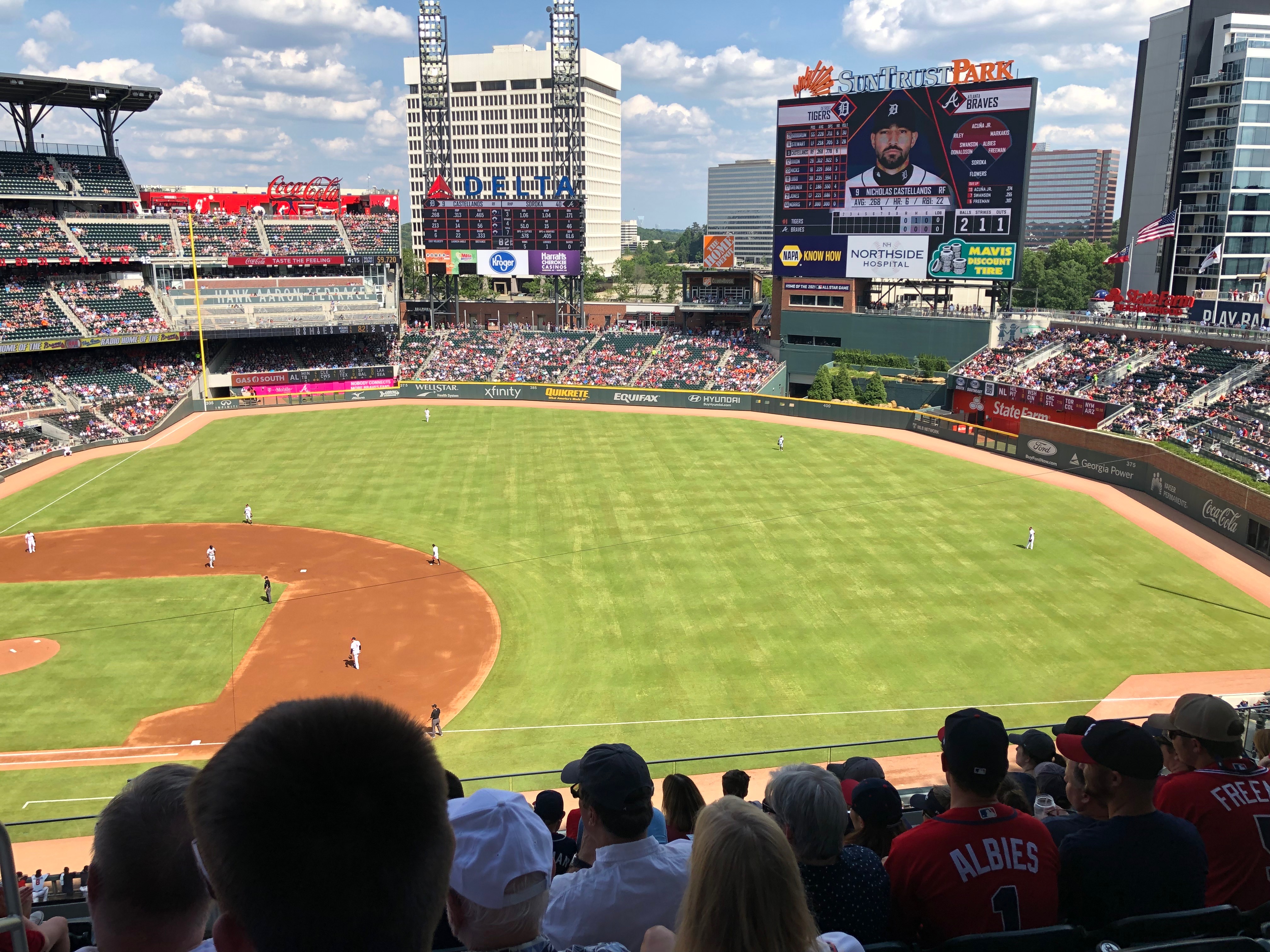 A sideline view of a sunny baseball field